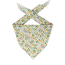 Flat lay of triangle-cut dog bandana with white rolled hem